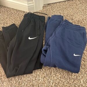 Nike sweatpants - 2 pairs. Men’s size medium. Black Blue. Good condition.